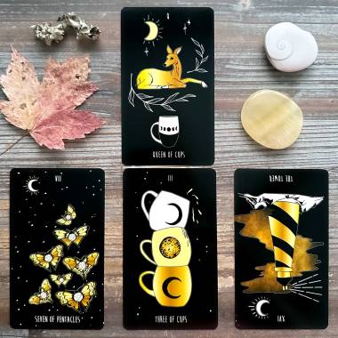 New Moon Tarot - The Tower, Queen of Cups, Seven of Pentacles, Three of Cups